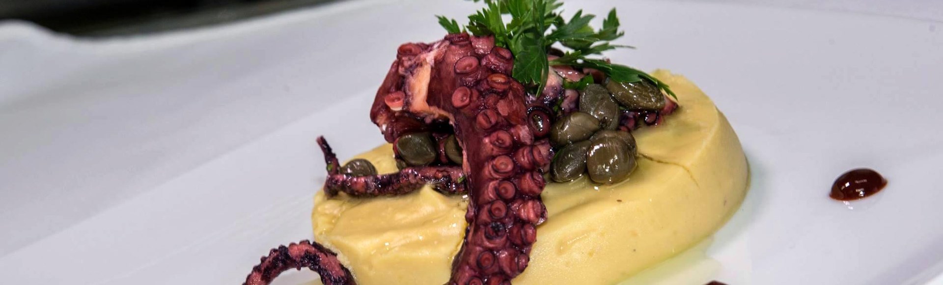 grilled-octopus-on-fava-bed-traditional-broad-peas-spread-served-with-caper-and-drops-of-balsamic-vinegar - Private Chef Service For Your Villa Holidays In Santorini, Cyclades, Greece